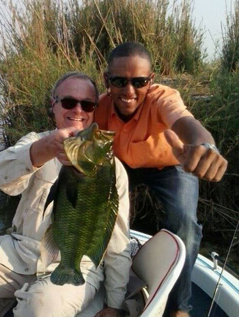 Joe and Fishing Client celebrate